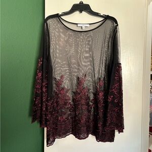 plus size sheer black top with purple embroidered detail on sleeves and bottom